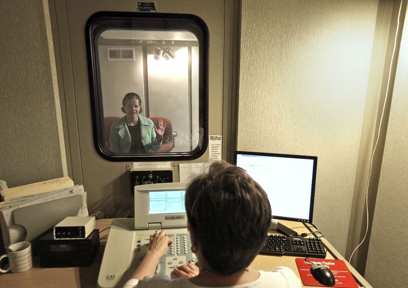 Jennifer Wood, a patient, has a hearing test conducted by Dr. Karen Mitchell, director of Audiology and Hearing Aid Services at the Columbus Speech & Hearing Center in Columbus, Ohio on May 29, 2014.
