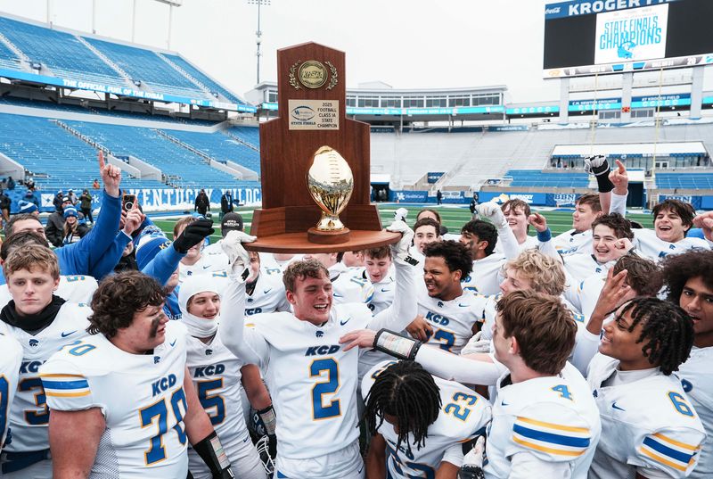 Winning their first ever football state championship, Kentucky Country Day coach Matthew Jones and the Bearcats celebrate after defeating Raceland at the KHSAA class 1A football state final at Kroger Field in Lexington Friday, December 5, 2025.