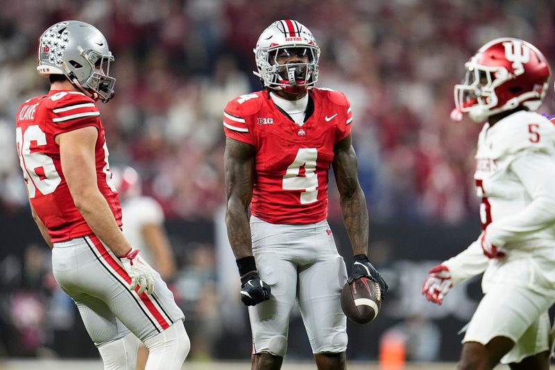 Ohio State Buckeyes wide receiver Jeremiah Smith (4) celebrates a catch during the first half of the Big Ten Conference championship game against the Indiana Hoosiers at Lucas Oil Stadium in Indianapolis on Dec. 6, 2025.