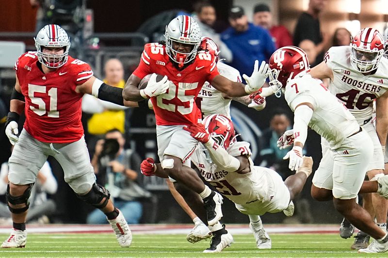Ohio State Buckeyes running back Bo Jackson (25) runs through Indiana Hoosiers linebacker Rolijah Hardy (21) during the Big Ten Conference championship game at Lucas Oil Stadium in Indianapolis on Dec. 6, 2025. Ohio State lost 13-10.