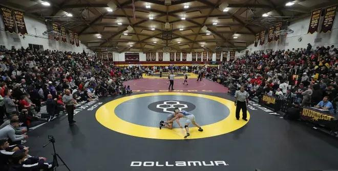 Wrestlers and fans pack into The Dome to watch the final round of the 2025 Ironman wrestling tournament at Walsh Jesuit High School.