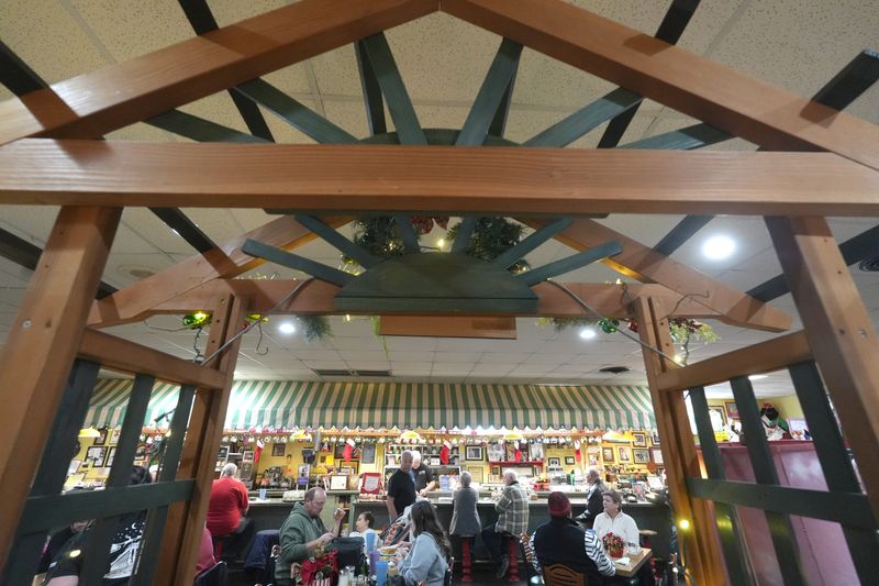 A wooden arch separates dining areas at Athens Restaurant in Canton. The eatery has announced it will close Dec. 24 after 50 years in business.