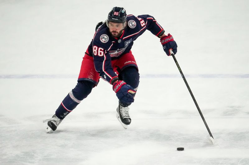 Columbus Blue Jackets right wing Kirill Marchenko (86) skates with the puck in the second period of the NHL game at Nationwide Arena on Saturday, Dec. 13, 2025 in Columbus, Ohio.