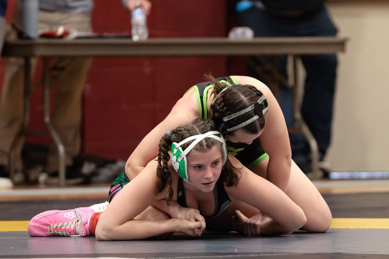 Mogadore’s Kai Gaetjens wrestles Taya Crookston of Ridgeline (Utah) at the Women of Ironman tournament Dec. 14, 2025.