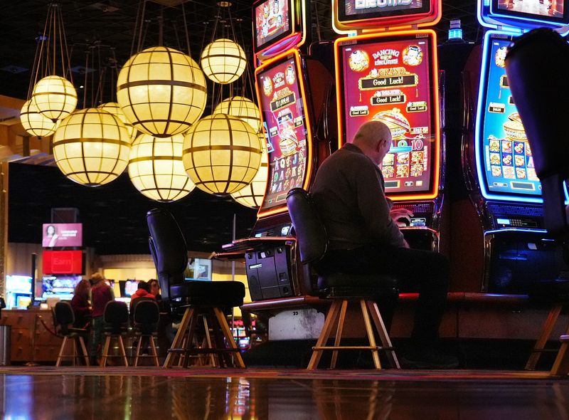 December 8, 2022; Columbus, Ohio; It's been 10 years since the casinos opened in Ohio; gambling in Ohio will include sports gaming on Jan. 1. A man plays a slot machine at Hollywood Casino. Fred Squillante-The Columbus Dispatch