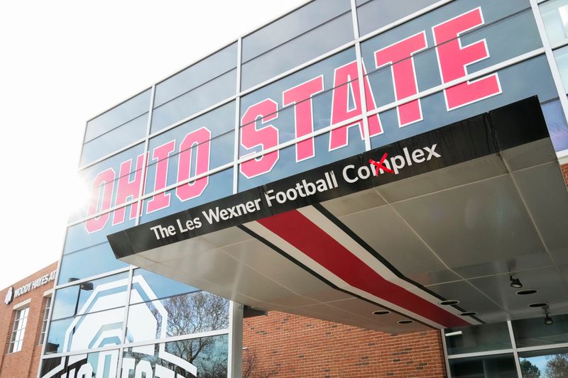 Sexual abuse survivors by former Ohio State University doctor Richard Strauss gather outside the Woody Hayes Athletic Center to call for Les Wexner's name to be removed from the facility during a press conference on Dec. 17, 2025. The building is also named The Les Wexner Football Complex.