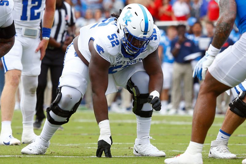 Kentucky Wildcats offensive lineman Jalen Farmer (52) waits for the snap against the Mississippi Rebels on Sept. 28, 2024, in Oxford, Mississippi.