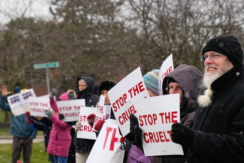 People protest outside the Immigration and Customs Enforcement Field Office on Friday, Dec. 19, 2025 in Westerville, Ohio. The protest is hosted by the Westerville Progressive Alliance.