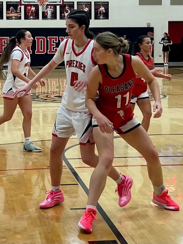 Pleasant's Mary Aurigemma (11) posts up while Marion Harding's Kailyn Simmons defends during a Mid Ohio Athletic Conference girls basketball game Dec. 20, 2025.