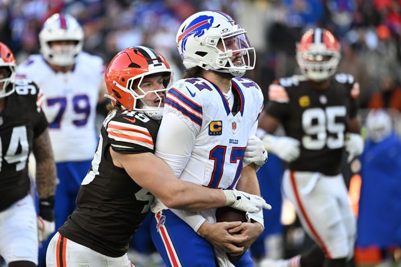 Dec 21, 2025; Cleveland, Ohio, USA; Buffalo Bills quarterback Josh Allen (17) is sacked by Cleveland Browns linebacker Carson Schwesinger (49) during the second half at Huntington Bank Field. Mandatory Credit: Ken Blaze-Imagn Images