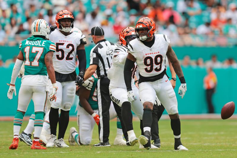 Dec 21, 2025; Miami Gardens, Florida, USA; Cincinnati Bengals defensive end Myles Murphy (99) reacts after a play during the third quarter against the Miami Dolphins at Hard Rock Stadium. Mandatory Credit: Sam Navarro-Imagn Images