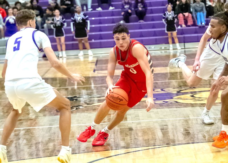 Bellevue's Sam Bollinger splits two Ross defenders.