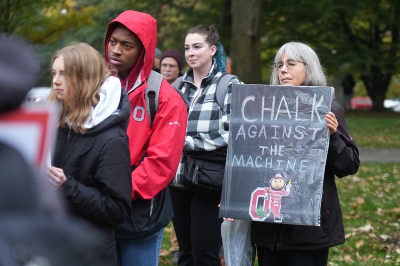 The American Civil Liberties Union of Ohio sent a letter to Ohio State University on July 30, 2026, demanding that it rescind its "unconstitutional" chalking ban on campus, claiming that the ban was enacted specifically to suppress pro-Palestine viewpoints. A woman is seen holding a "chalk against the machine" sign during a "free speech" rally on Nov. 7, 2025.
