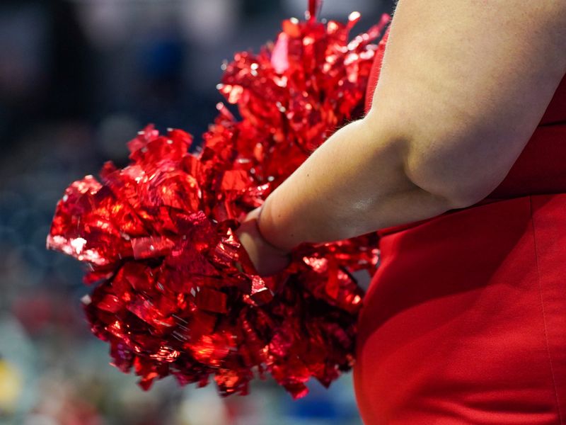 A La Salle cheerleader ruffles her pom-poms during a game between the Lancers and Sycamore Aviators at the Holiday Hardwood Classic on Dec. 27, 2025.