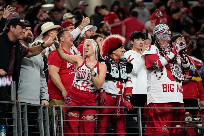 Ohio State Buckeyes fans cheer during the Cotton Bowl at AT&T Stadium in Arlington, Texas for the College Football Playoff quarterfinal game against the Miami Hurricanes on Dec. 31, 2025.