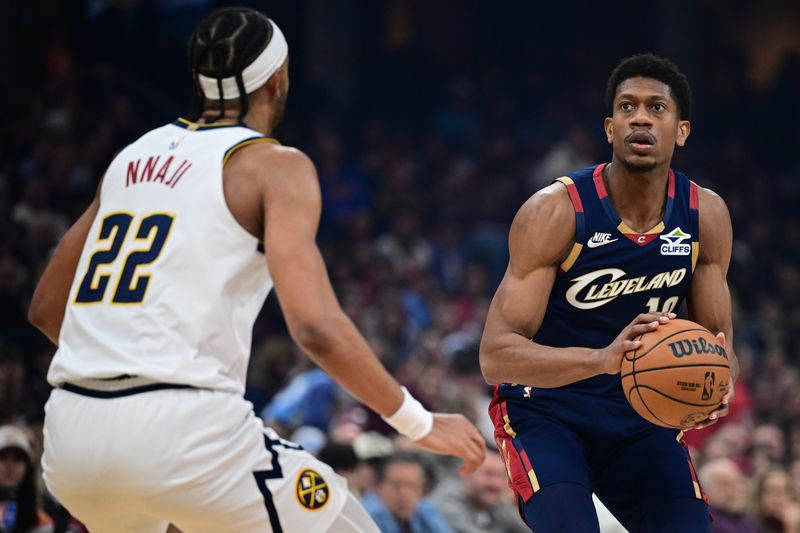 Cleveland Cavaliers forward De'Andre Hunter (12) looks to shoot against Denver Nuggets forward Zeke Nnaji (22) on Jan. 2, 2026, in Cleveland.