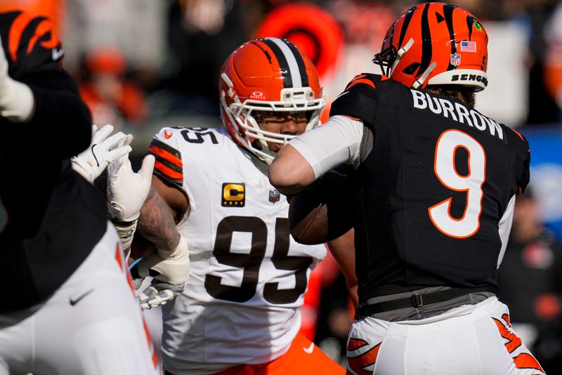 Myles Garrett (95) sacked Bengals quarterback Joe Burrow (9) three times during the 2025 season.