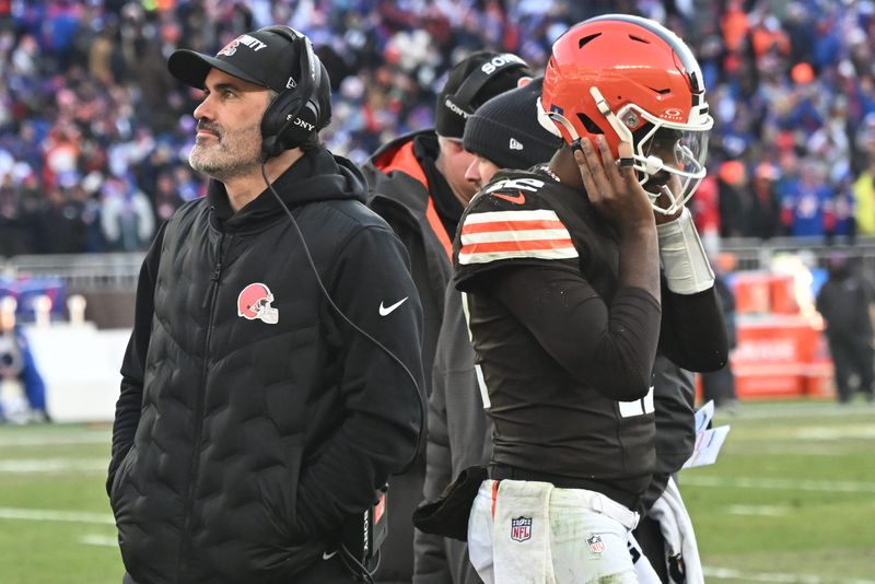 Dec 21, 2025; Cleveland, Ohio, USA; Cleveland Browns head coach Kevin Stefanski and quarterback Shedeur Sanders (12) on the sidelines against the Buffalo Bills during the second half at Huntington Bank Field. Mandatory Credit: Ken Blaze-Imagn Images