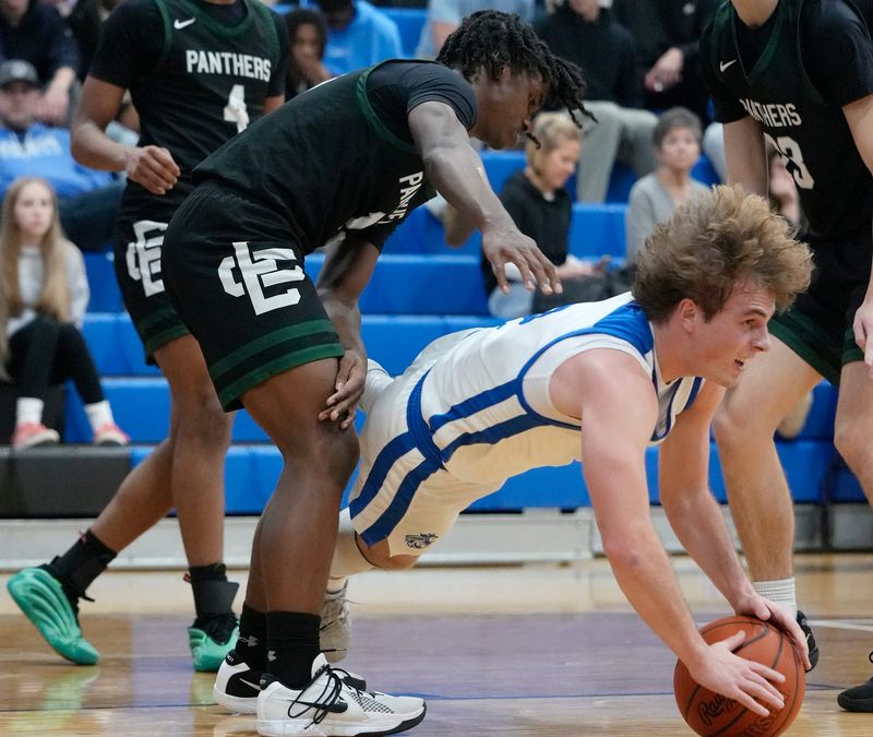 Elyria Catholic defender watches as CVCA’s Charley Levak (2) dives for the ball during the game at Cuyahoga Valley Christian Academy on Jan. 6, 2026.
