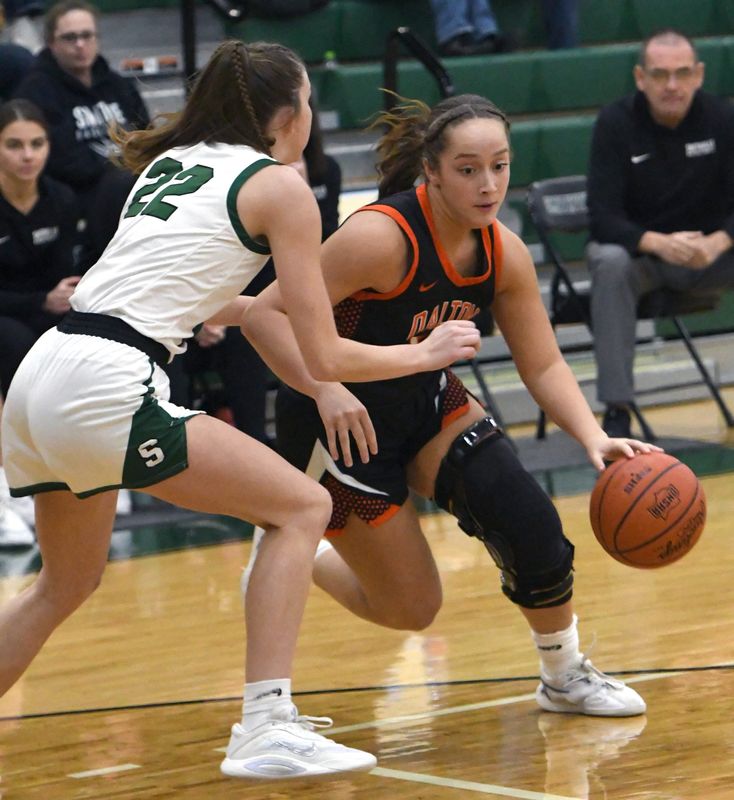Dalton's Phoebe Lehman drives on Smithville's Kiersten Ross.