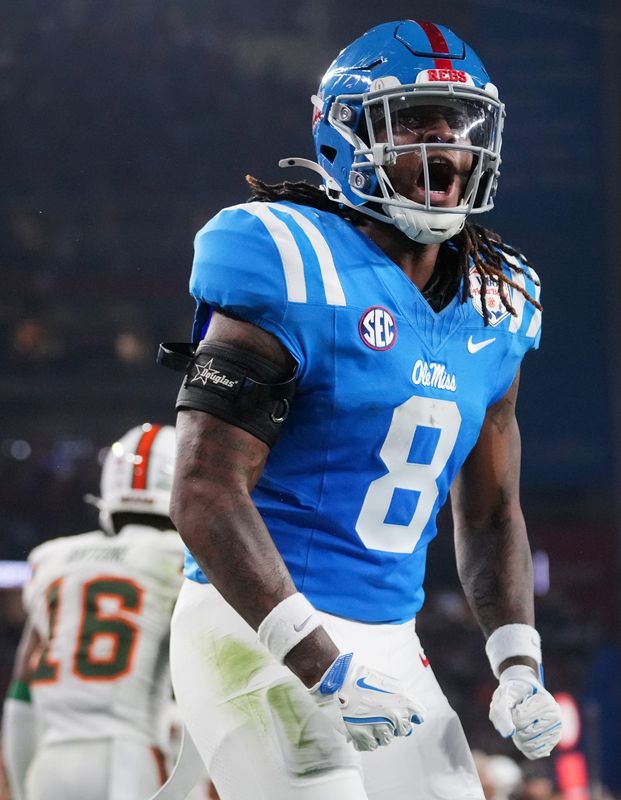 Ole Miss Rebels tight end Dae'Quan Wright (8) celebrates his touchdown catch against the Miami Hurricanes during their Vrbo Fiesta Bowl matchup at State Farm Stadium on Jan. 8, 2026.