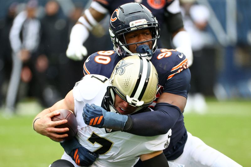 Bears defensive end Dominique Robinson makes a tackle for a loss on New Orleans Saints tight end Taysom Hill during the second quarter at Soldier Field, Oct. 19, 2025, in Chicago.