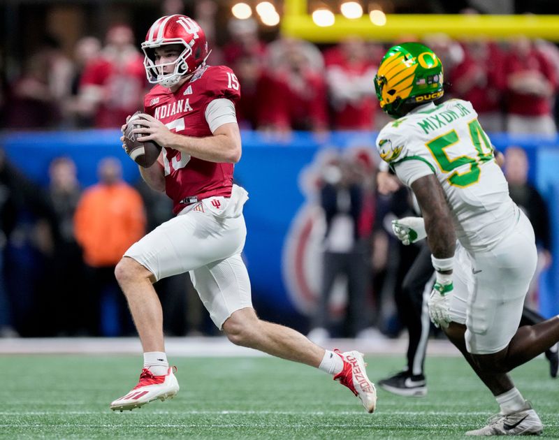 Indiana Hoosiers quarterback Fernando Mendoza (15) looks for an open receiver Friday, Jan. 9, 2026, during the Peach Bowl and semifinal game of the College Football Playoff against the Oregon Ducks at Mercedes-Benz Stadium in Atlanta.