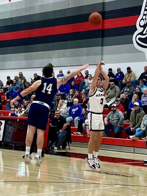 Pleasant's Avery Hamper shoots over the defense of Highland's Jayden Collins during a Mid Ohio Athletic Conference boys basketball game Jan. 9, 2026 at Pleasant.