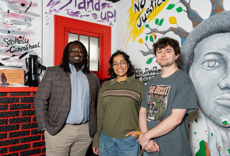 From left, Imokhai Okolo, Parinita Singh and Trey Phillips of the Freedom BLOC gather Jan. 9 at the organization's Akron headquarters to discuss the group's ballot proposals for housing policy.
