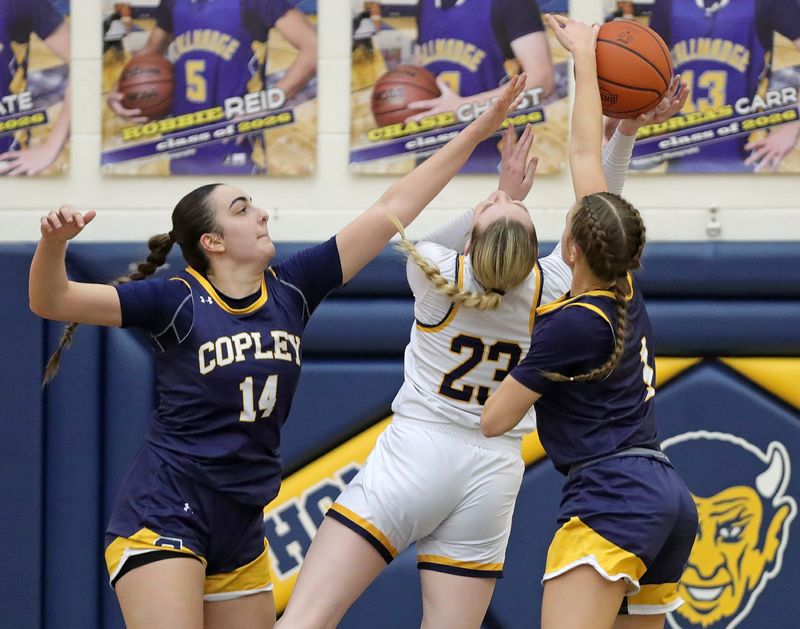 Copley's Alejandra Morrondo-Garcia (14) and Evelyn McKnight work to block the shot of Tallmadge's Jonna Albertson on Jan. 10, 2026.