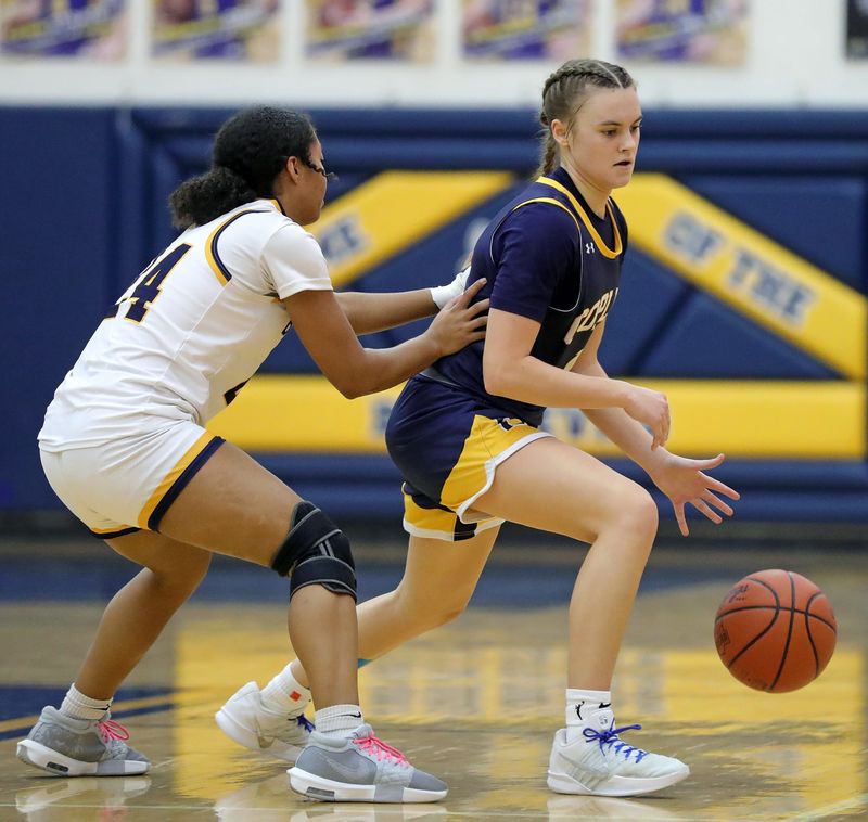 Copley point guard Evelyn McKnight, right, controls the ball against Tallmadge’s Jada Kendrick on Jan. 10, 2026, in Tallmadge.