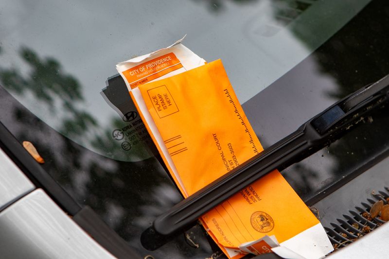 A car parked on Canal Street at a parking meter has two parking tickets on May 23, 2025.