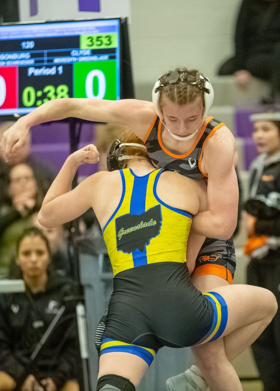 Clyde's Meredith Greenslade an Gibsonburg's Allison Schroeder wrestle in the 120 pound championship match.