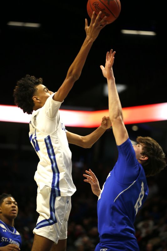 CovCath's Braeden Myrick puts up a shot against St. Xavier.