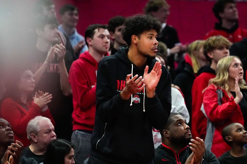 Ohio State Buckeyes Puff Johnson claps for his teammates in overtime in the NCAA basketball game at Value City Arena on Tuesday, Jan. 20, 2026 in Columbus, Ohio.
