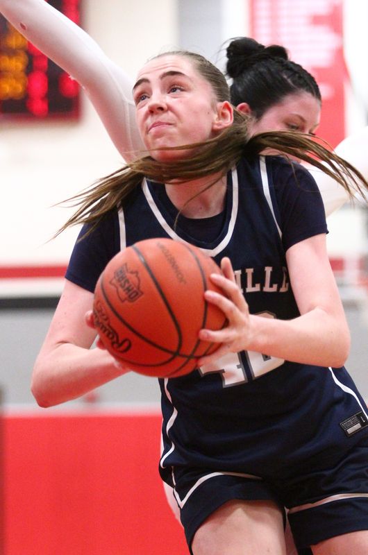 Granville's Elle Mortimer steps past Johnstown's Lauren Baughman in the post during the visiting Blue Aces' 53-27 victory on Jan. 21, 2026.