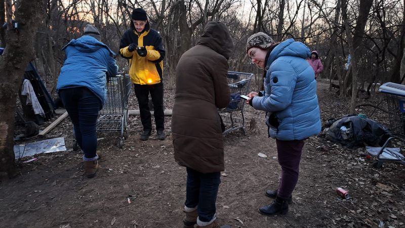 Jaden Lunger (left) and Emily Thornton-Wourms conduct a survy of people who are homeless as volunteers and staff members from more than 15 organizations assisted the Community Shelter Board in their “Point-In-Time Count” of homeless people in Columbus and Franklin County on Jan 22, 2026. Both Lunger and Thornton-Wourms work for YMCA housing programs.