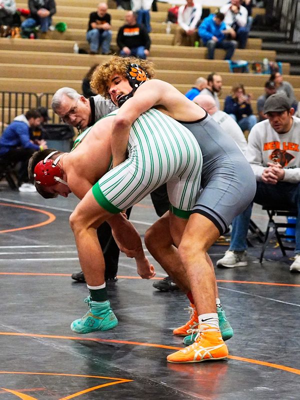 New Lexington junior Tyson Spicer wrestles Barnesville's Colt Carpenter in the finals at 144 pounds during the Jimmy Wood Invitational on Saturday, Jan. 24, 2026, at New Lexington High School. Spicer was voted Most Valuable Wrestler after winning by major decision.