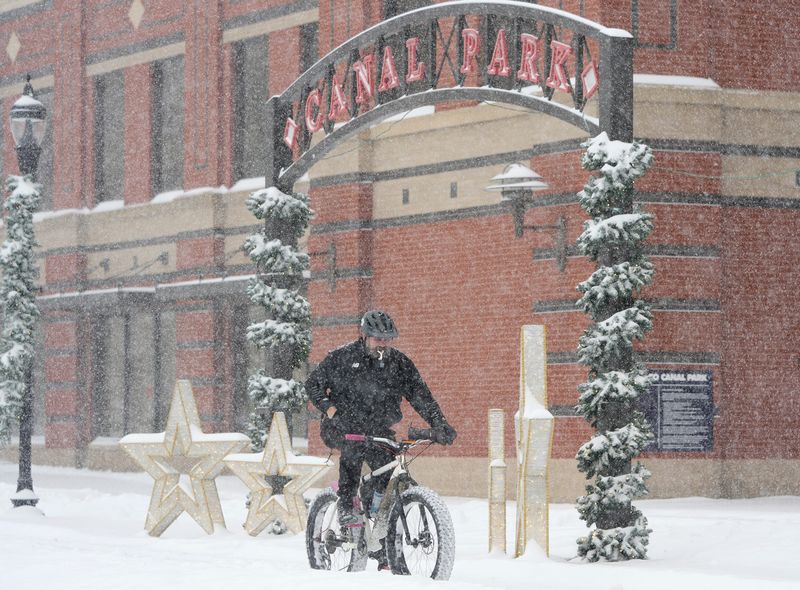 Dave Gelhar of Brunswick rides his bike down Main Street in Akron on Jan. 25, 2026. Gelhar was participating in Dirty River Bicycle Works Yeti Squad Sunday ride.