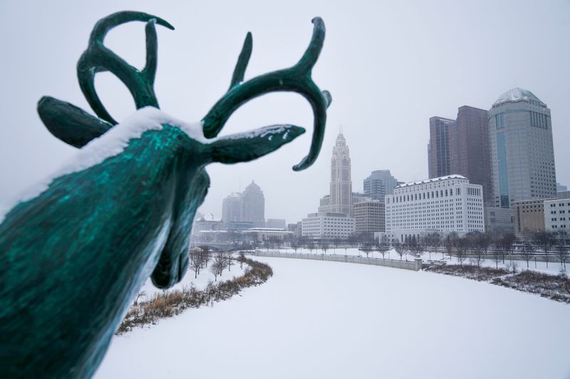 A deer statue on the Rich Street bridge watches as Winter Storm Fern continues to dump snow on the Columbus skyline on Jan. 25, 2026.