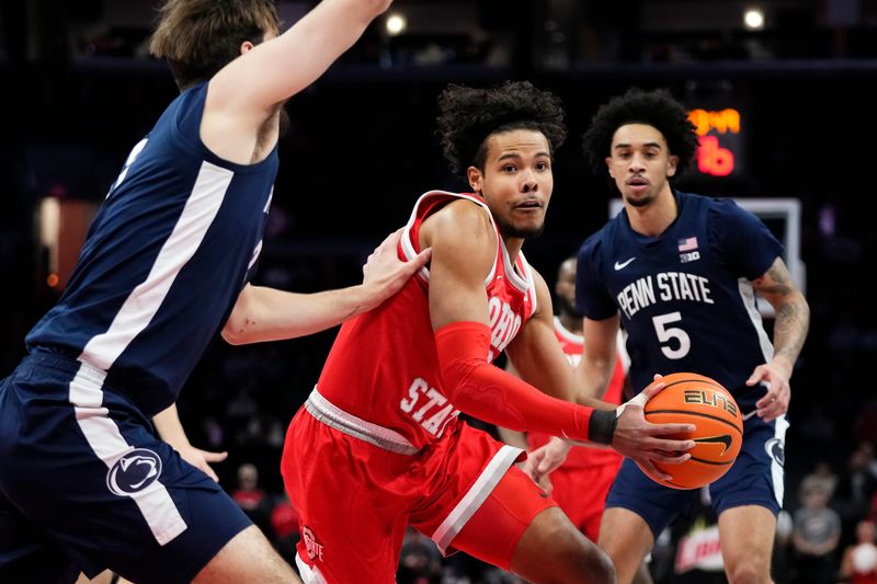 Ohio State Buckeyes forward Puff Johnson (6) drives past Penn State Nittany Lions forward Ivan Juric (3) during the first half of the NCAA men's basketball game at the Schottenstein Center in Columbus on Jan. 26, 2026.