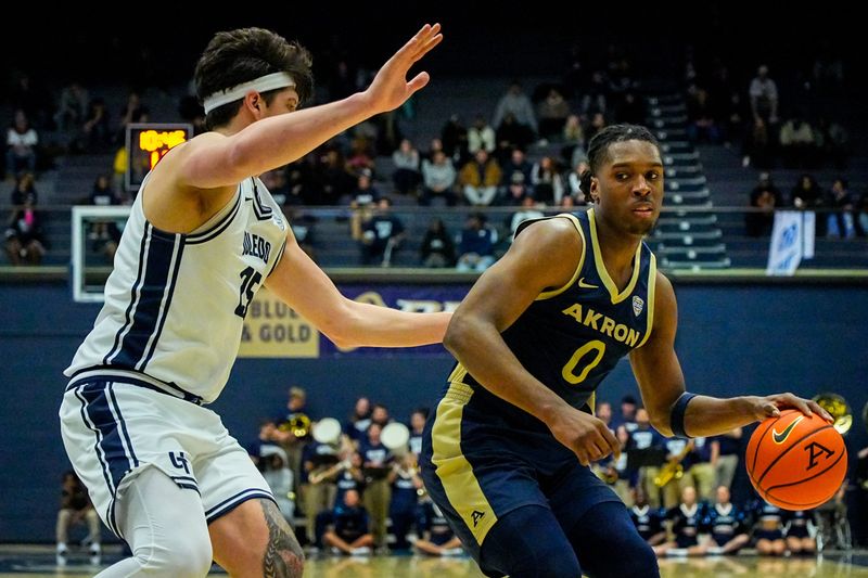 Akron’s Amani Lyles dribbles around Toledo defensive pressure, Jan. 27, 2026.