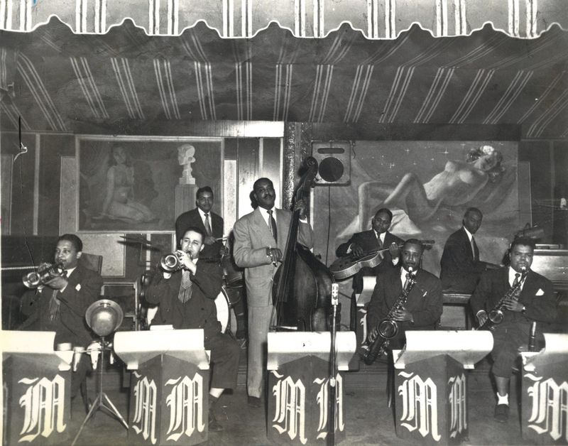 Monty “Frog” Morrison Band at the Cotton Club. Front, left to right, Tubby Williams, Christopher Perkins, Monty “Frog” Morrison, Paul Renfro, Archie Heard. Rear, left to right, Nelson Burton, William Gaddy, Herman Smith.