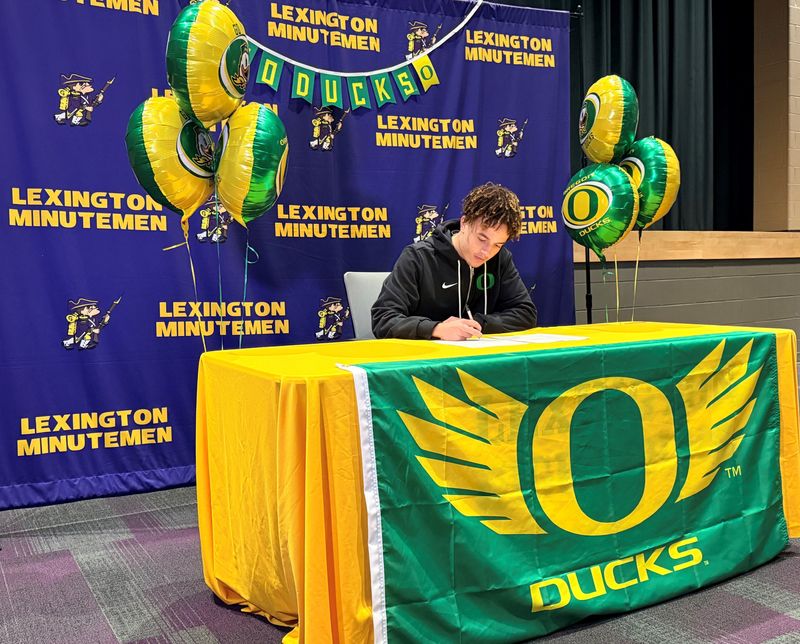 Lexington senior Latrell Hughes signs his National Letter of Intent to run track at the University of Oregon on Thursday, Jan. 29, in front of friends, family, coaches and teammates.