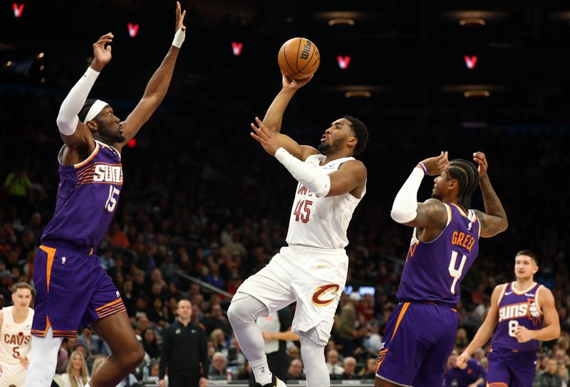 Cleveland Cavaliers guard Donovan Mitchell (45) shoots the ball over Phoenix Suns center Mark Williams (15) on Jan. 30, 2026, in Phoenix, Arizona.