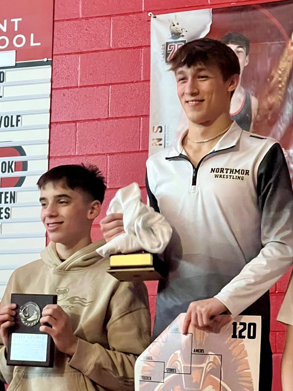 Northmor's Ethan Amens, right, stands atop the podium with Mount Gilead's Rocco Castricone finishing second at 120 pounds in the finals of the Sally George Wrestling Invitational at Pleasant Jan. 31, 2026.