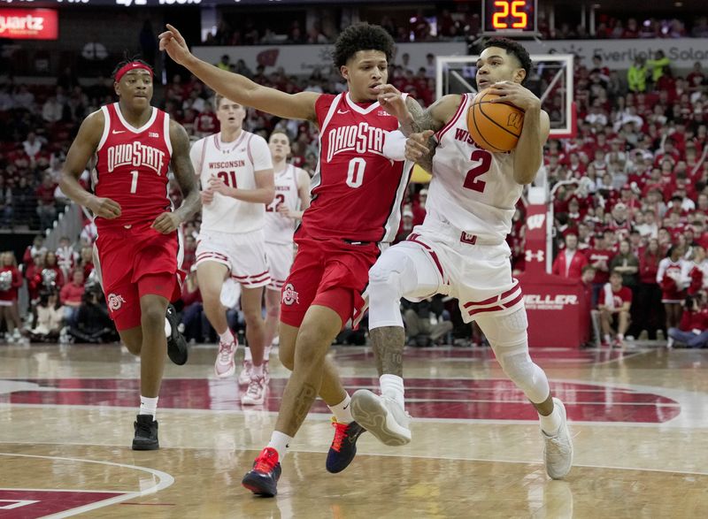 Wisconsin guard Nick Boyd (2) gets tangled top with Ohio State guard John Mobley Jr. (0) during the second half of their game Saturday, January 31, 2026 at the Kohl Center in Madison, Wisconsin. Wisconsin beat Ohio State 92-82.