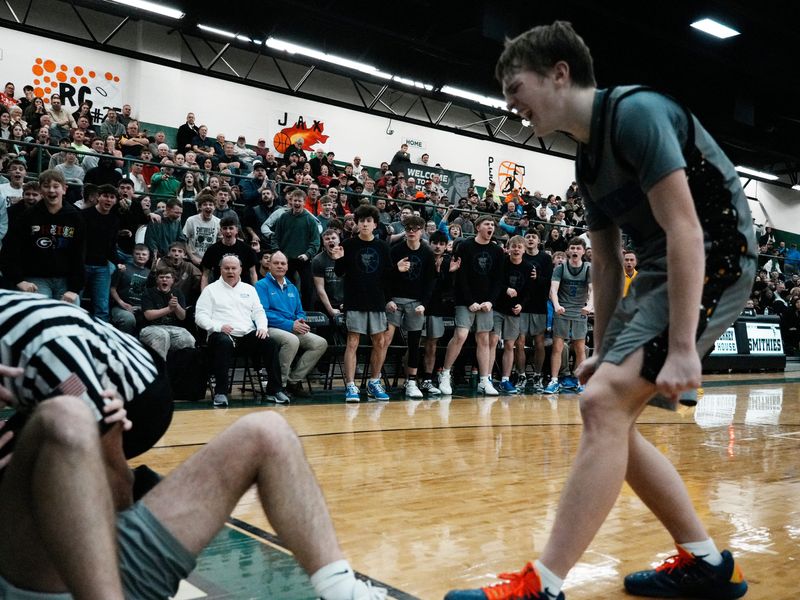 An excited Gator Nichols and teammates on the bench celebrate a Jordyn Watson layup during Maysville's 82-76 win against three-time defending state champion Cleveland Heights Lutheran East on Feb. 1, 2026, at Berkey Fieldhouse in Smithville, Ohio. Watson and Nichols combined for 71 points as the Panthers handed LE its first loss of the season.