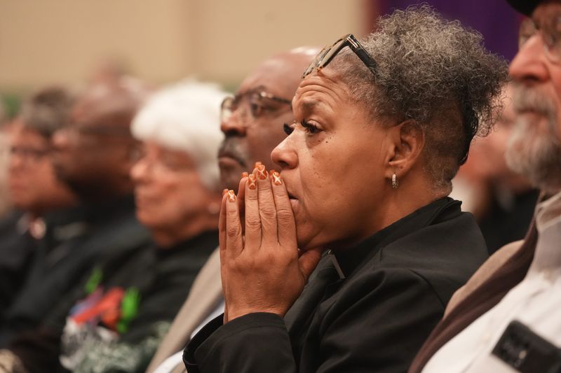 An attendee prays during a prayer service and faith leaders gathering at St. John Missionary Baptist Church in Springfield, Ohio on Feb 2, 2026. Springfield is home to one of the largest Haitian immigrant communities in the Midwest and a focal point of national political rhetoric.