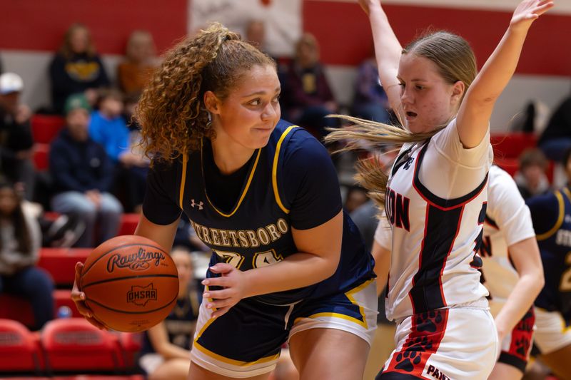 Streetsboro's Carlee Bedford looks to get past Norton’s Brooke Bowman during a high school basketball game on Monday, February 2, 2026 in Norton, OH.